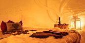 Interno dell’igloo con luci soffuse e atmosfera calda